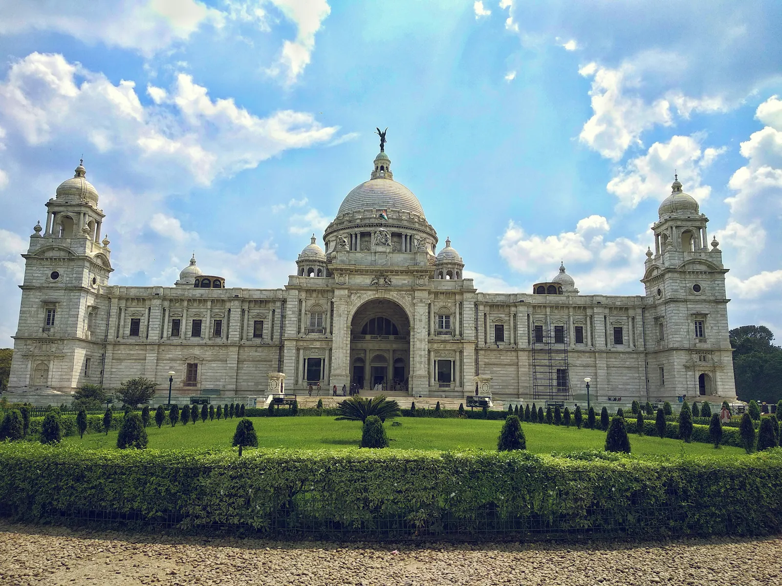 Victoria Memorial, Kolkata — white marble building with dome under a blue sky with clouds